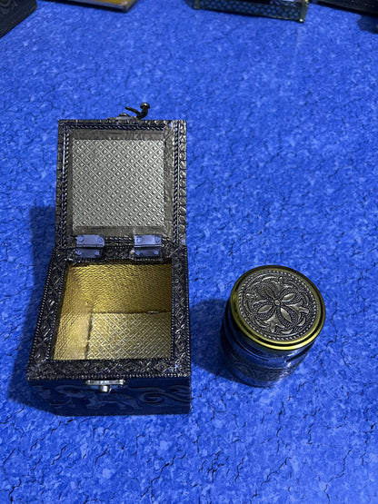 Brass elephant dryfruat box on wooden surface