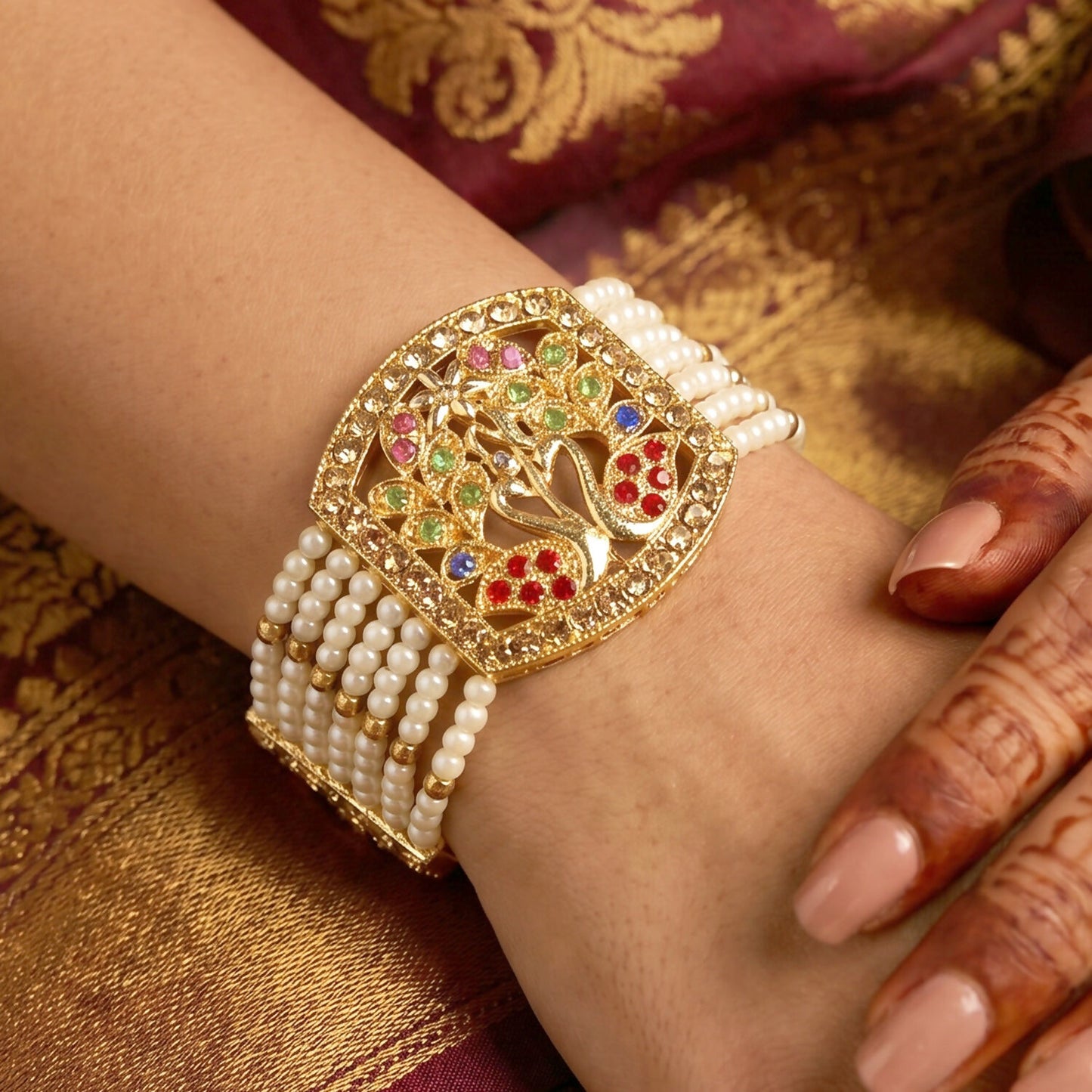 Close-up of pearl and colorful stones on bridal bracelet