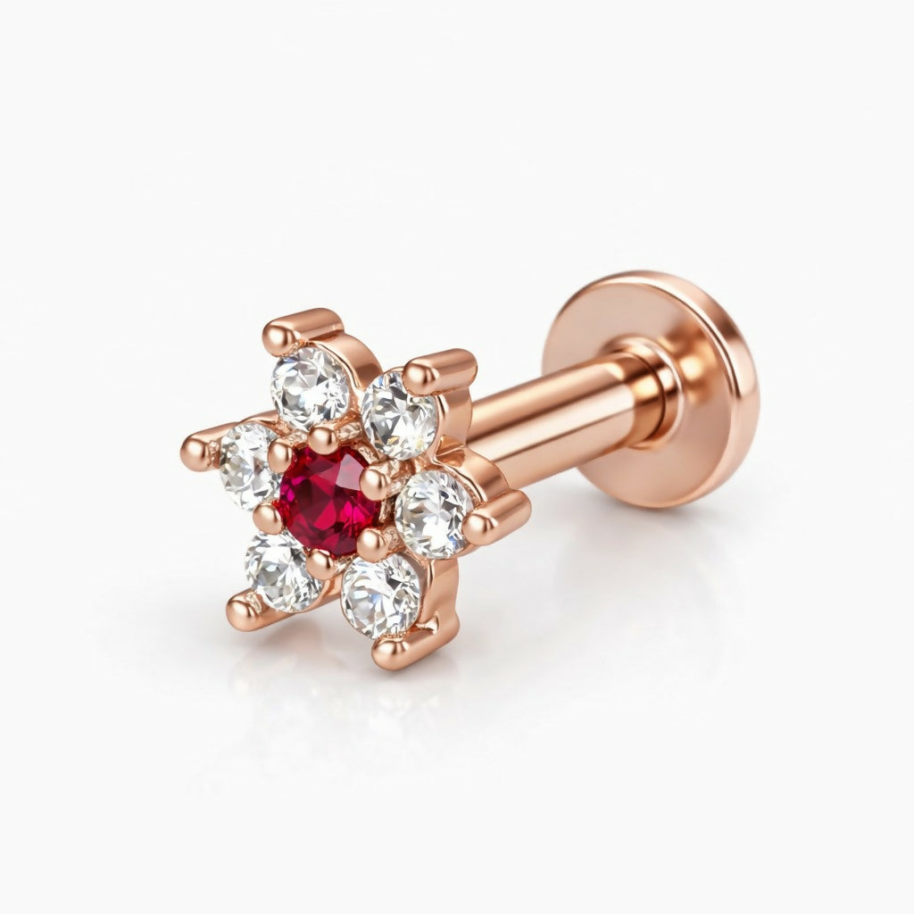 Rose gold flower stud earring featuring ruby and diamond-white stones delicately arranged