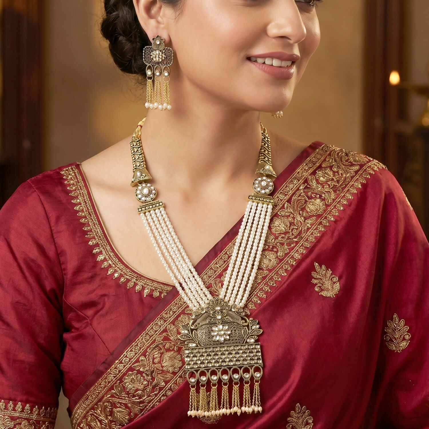 Close-up of antique gold pendant on pearl necklace