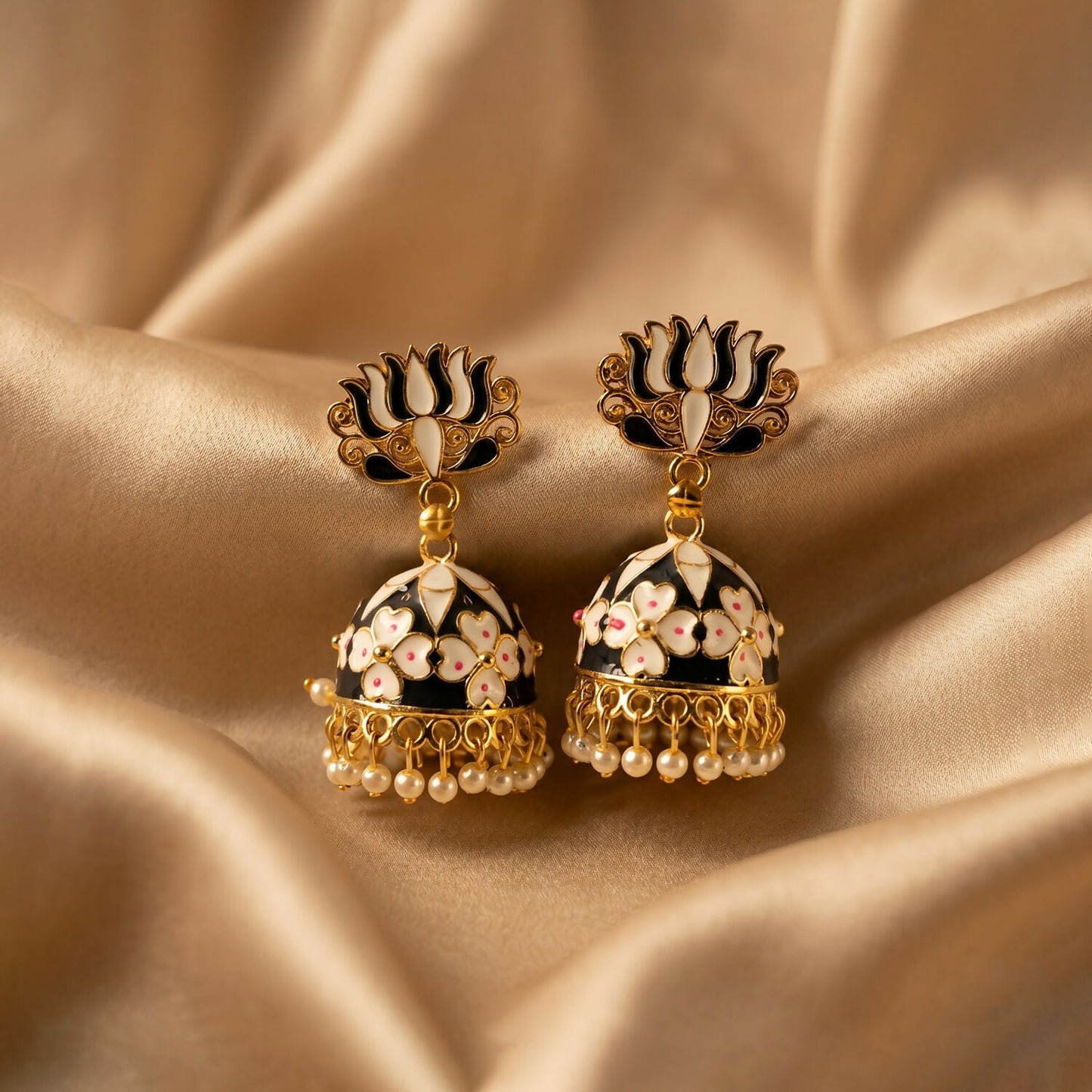 Detailed golden finish on lotus jhumka earrings