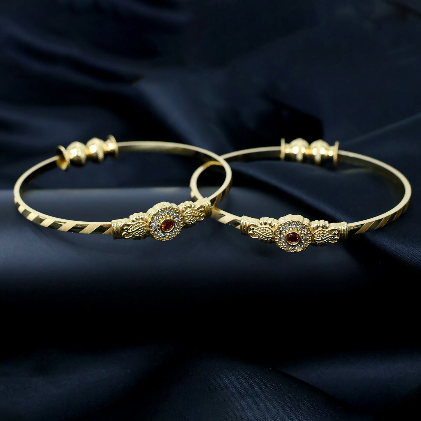 Close-up of slim textured band on floral bangle
