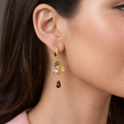 Close-up of trendy hoop-lock gold-tone earrings featuring vibrant multicolor stones