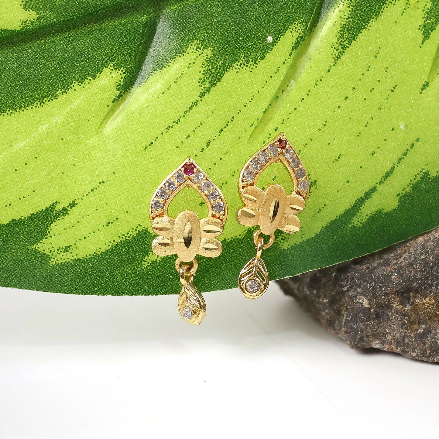 Modern Floral Gold Finish Stud Earrings With Polished Texture And Drop Accent