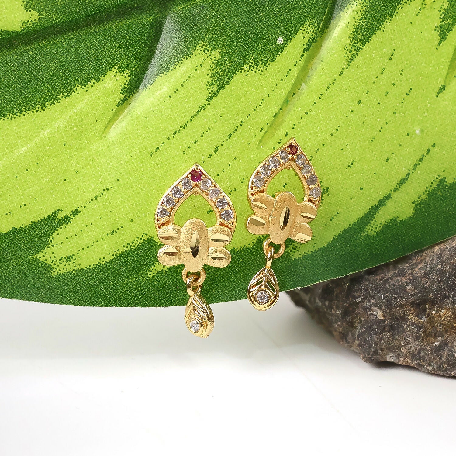 Modern Floral Gold Finish Stud Earrings With Polished Texture And Drop Accent