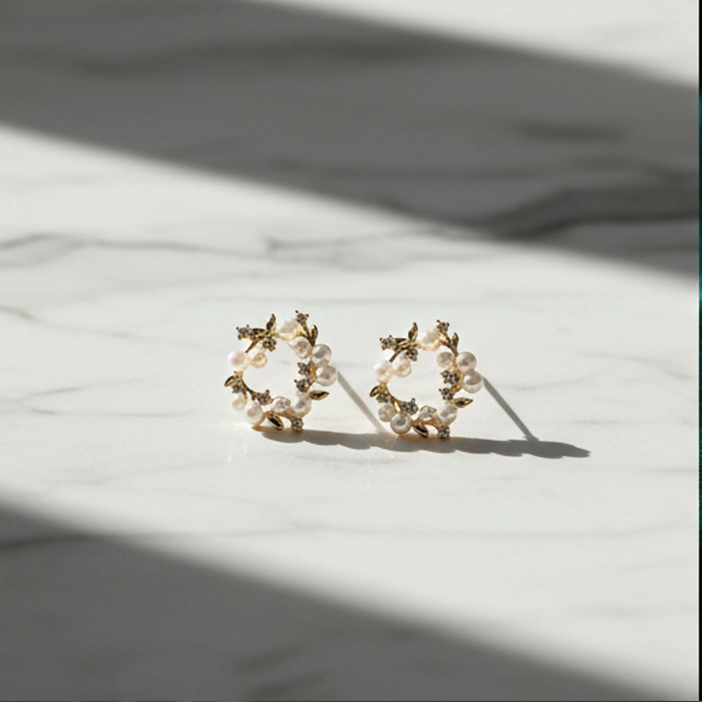 Golden floral halo earrings with pearl and crystal detail