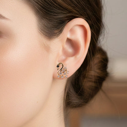 Close-up of swan shape CZ stud earrings highlighting sparkling stones