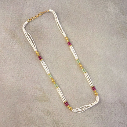 Side view of traditional mala necklace with layered beads and gold accents