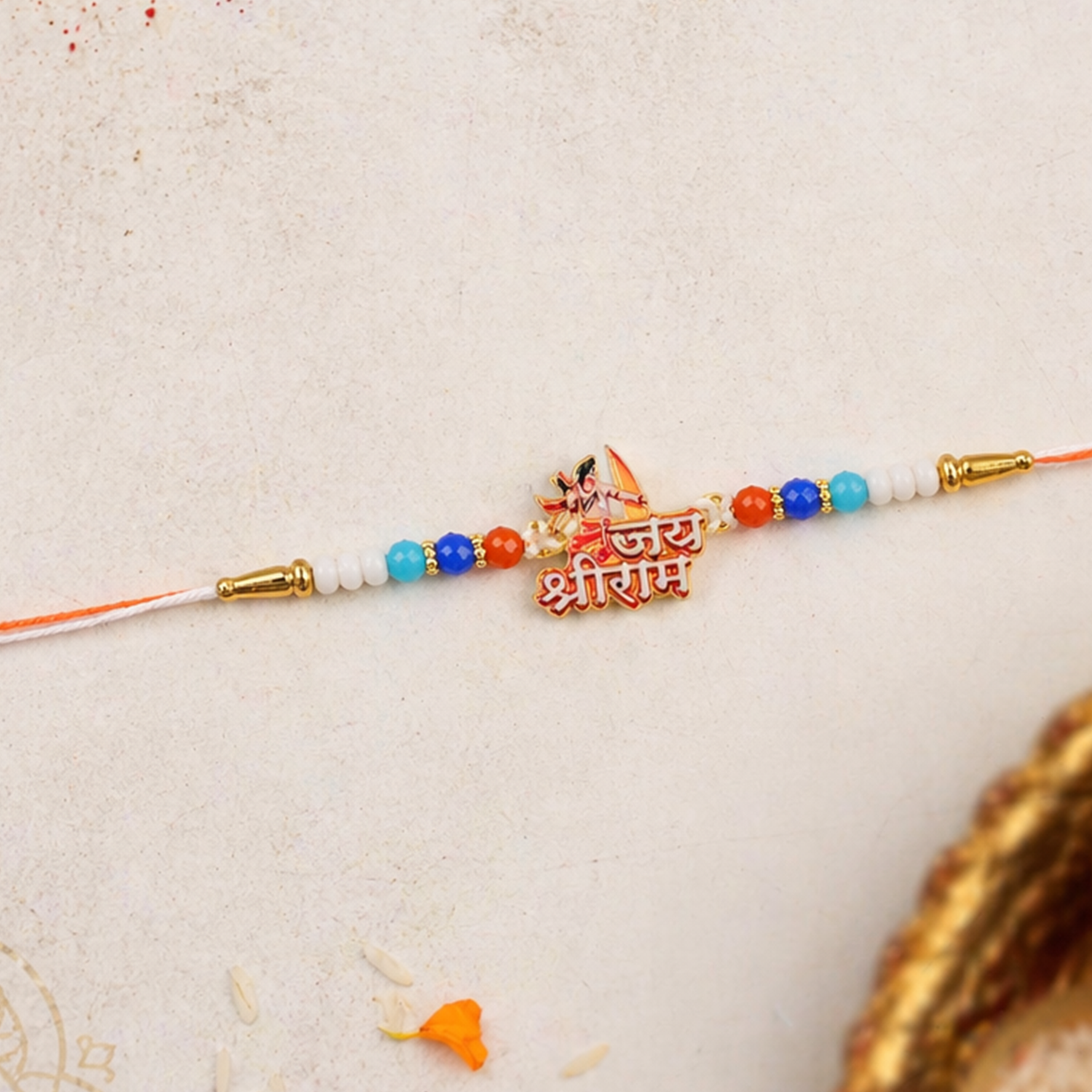 Designer rakhi with beads and traditional centerpiece