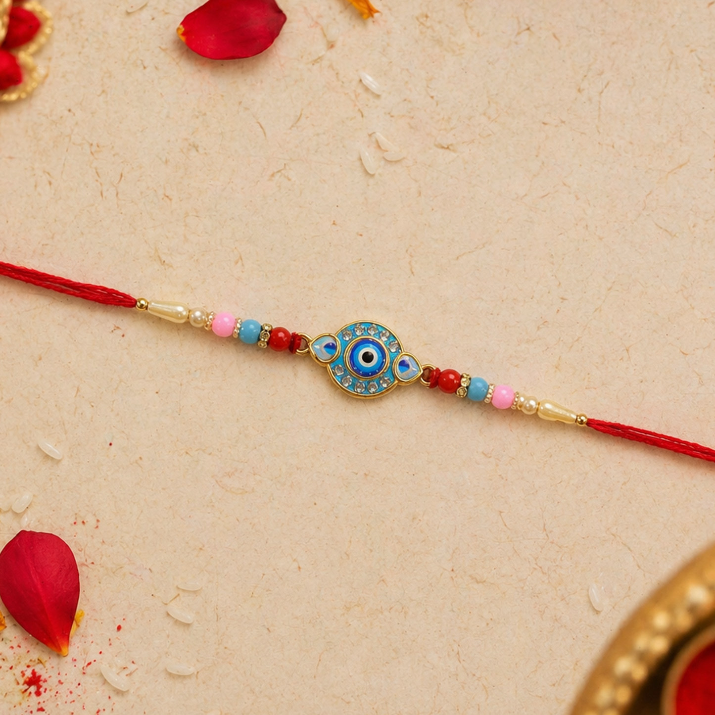Evil Eye centerpiece detail on designer Rakhi