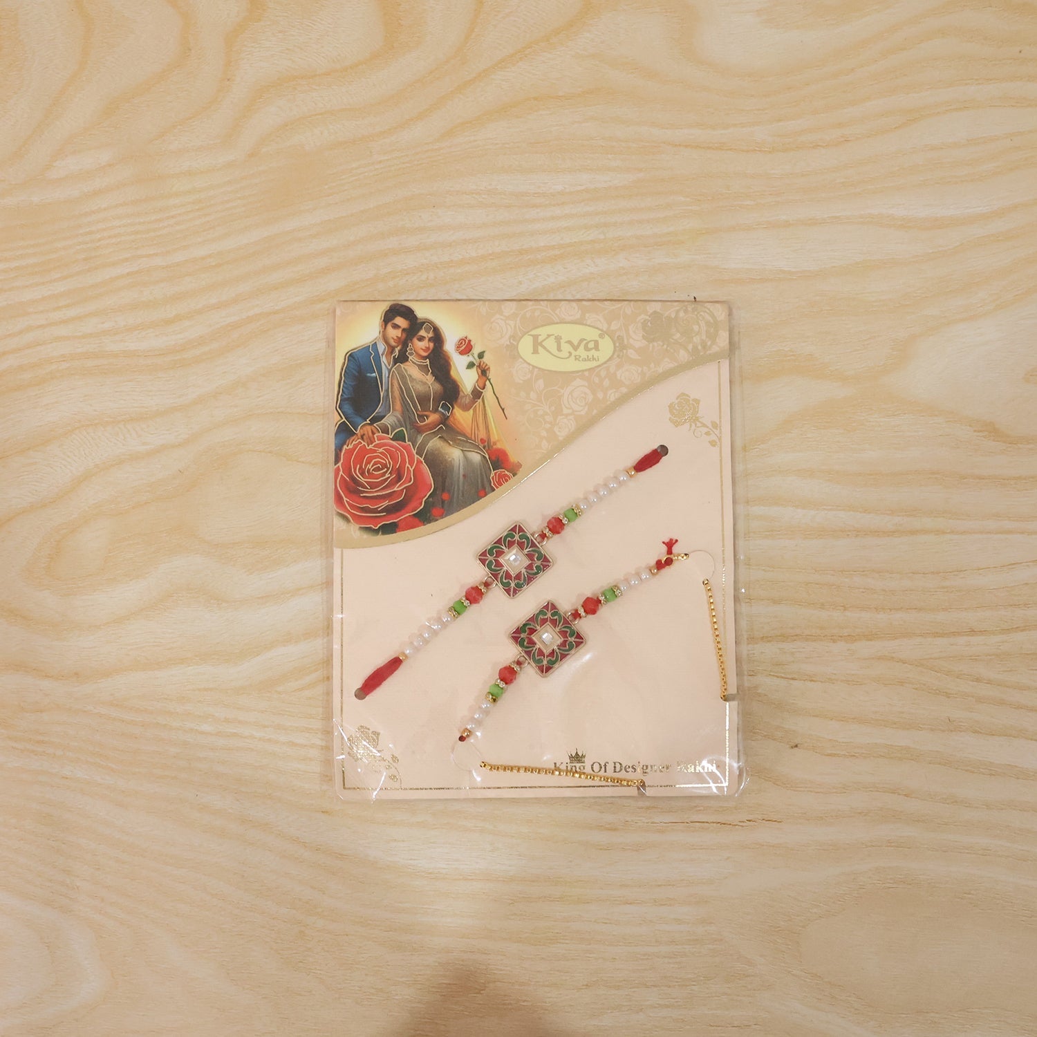 Live shot of traditional square designer Rakhi with pearl beads