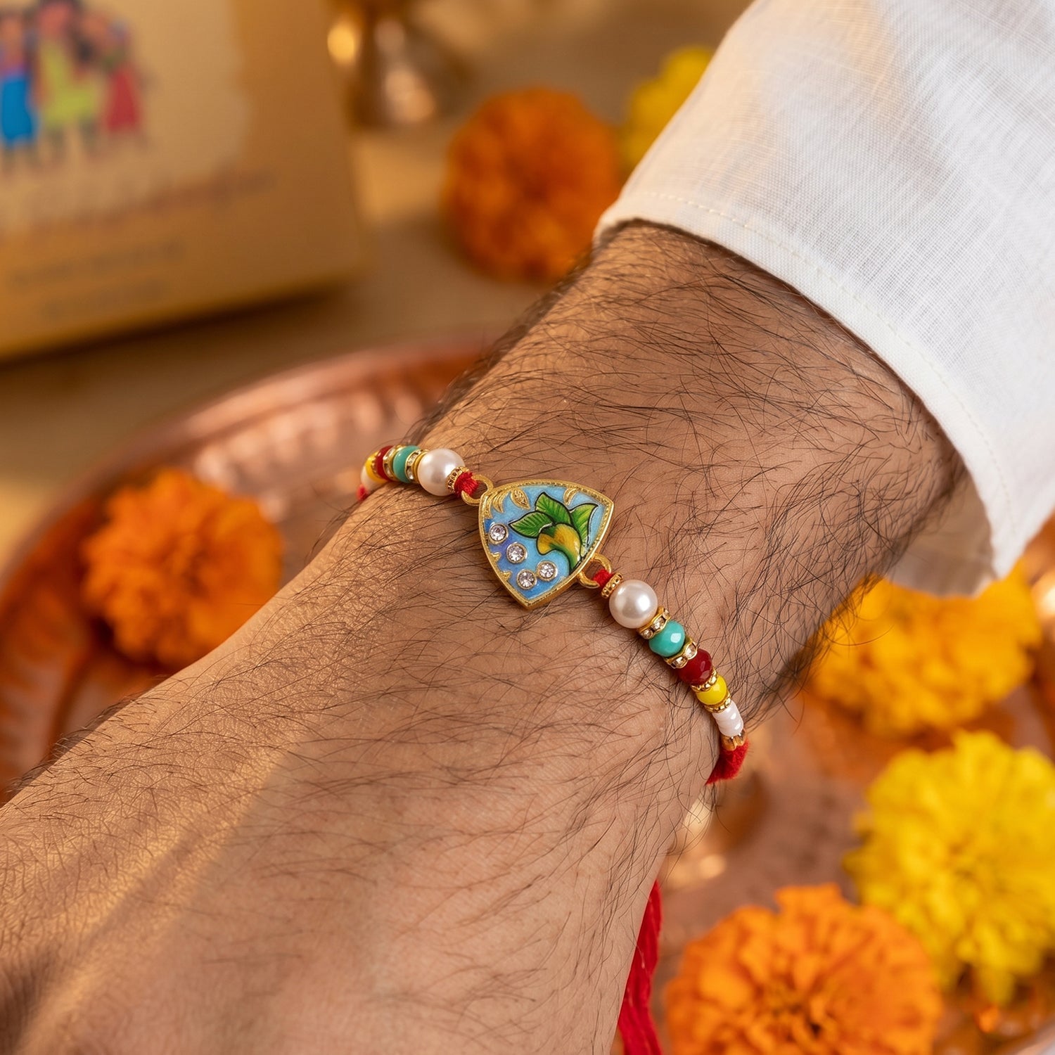 Colorful beads and stylish centerpiece of leaf rakhi