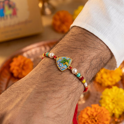 Colorful beads and stylish centerpiece of leaf rakhi