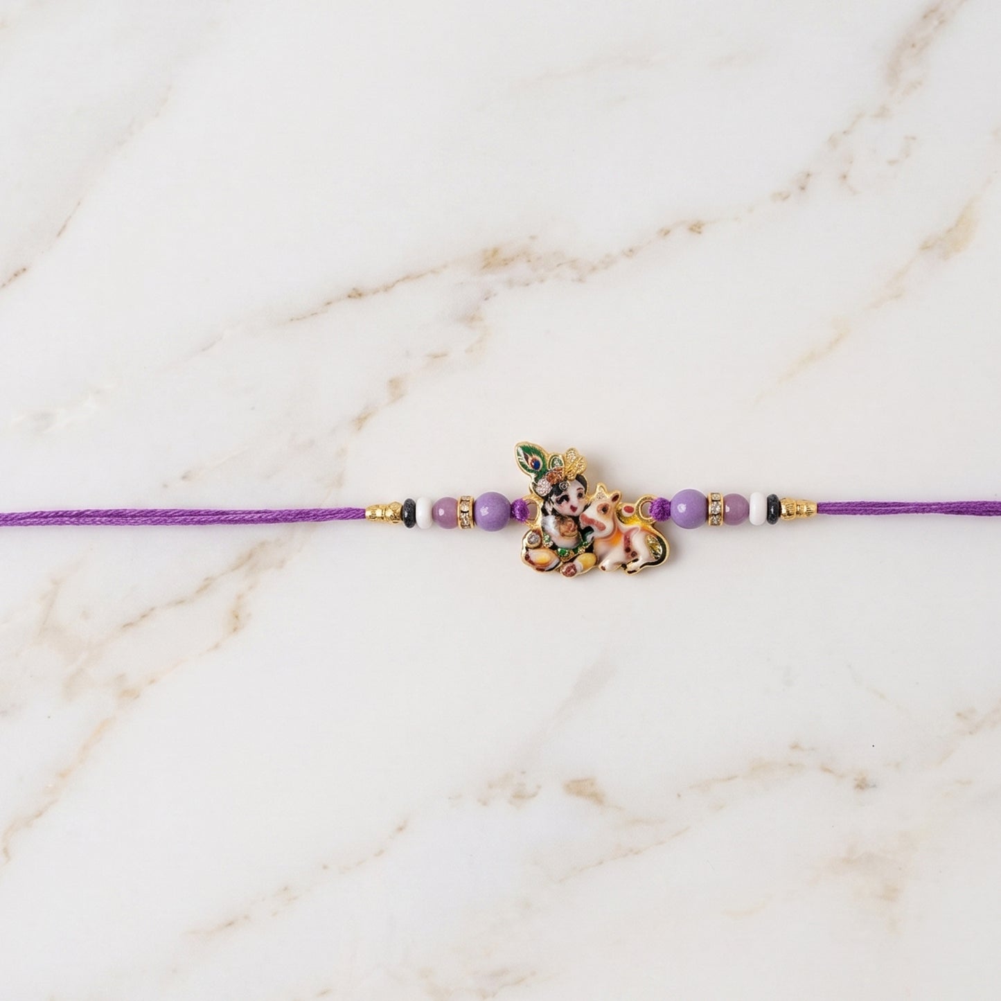 Bal Krishna rakhi displaying colorful beads on thread