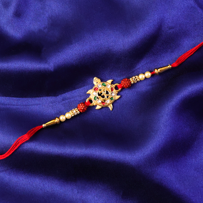 Detailed view of decorative beads on Om symbol rakhi