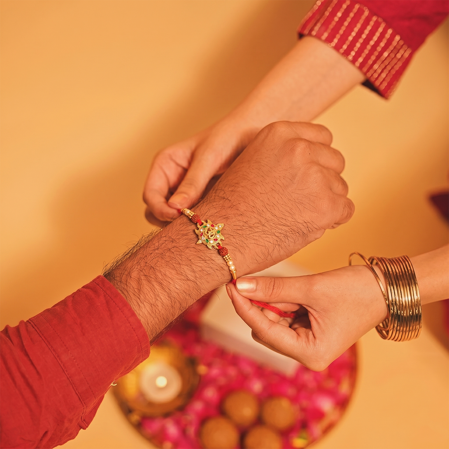 Side view of Divine Om Symbol Rakhi with colorful stones