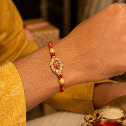 Close-up of designer Rakhi with stylish centerpiece and bead details