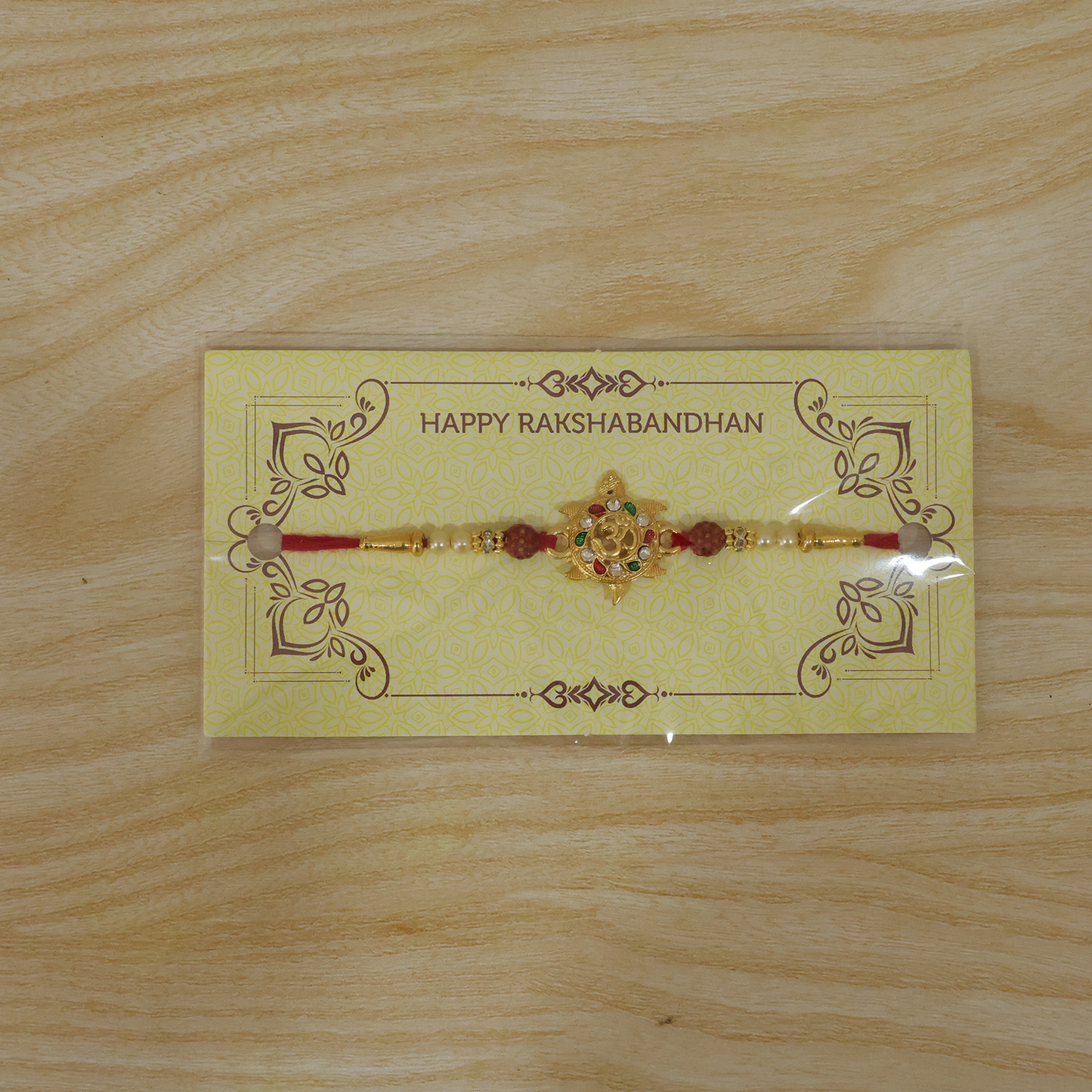 Divine Om Symbol Designer Rakhi shown live on wrist