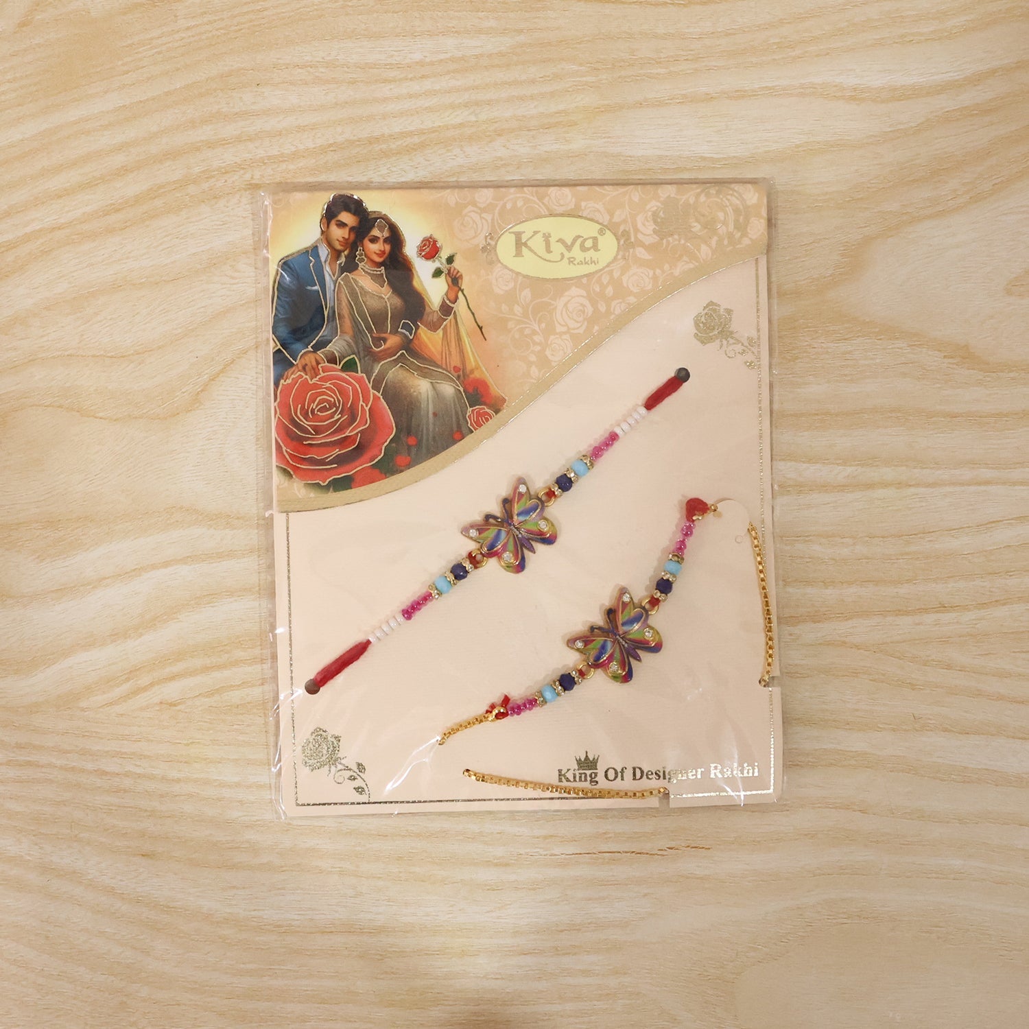 Rainbow Butterfly Designer Rakhi on a hand showing scale