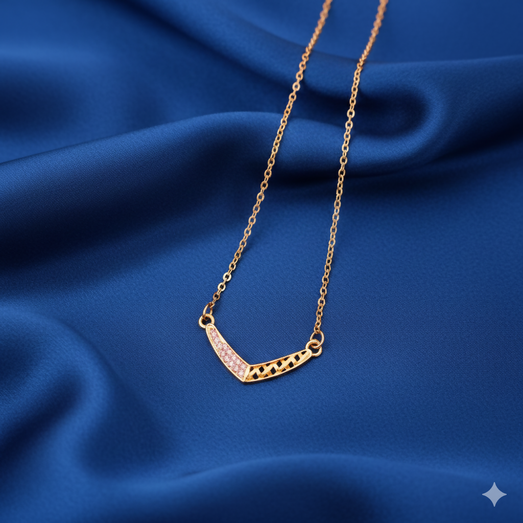 Front view of gold plated V-shape geometric lattice necklace with pink crystals