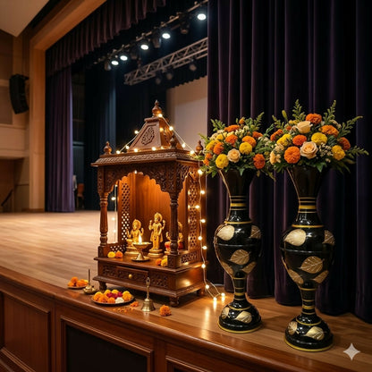 Tall metal vase used as Pooja room decoration