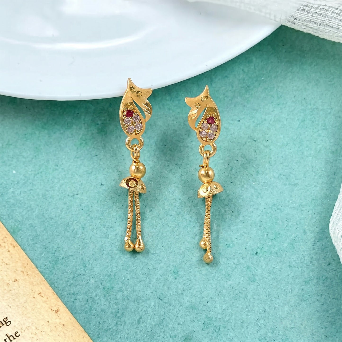 Close-up showing leaf motif and cubic zirconia stones