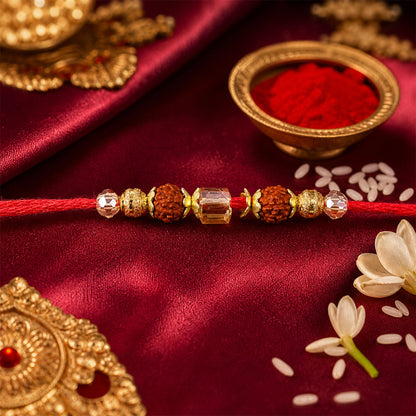 Red Thread Rakhi with Rudraksha and Sparkling Crystal Bead Accents