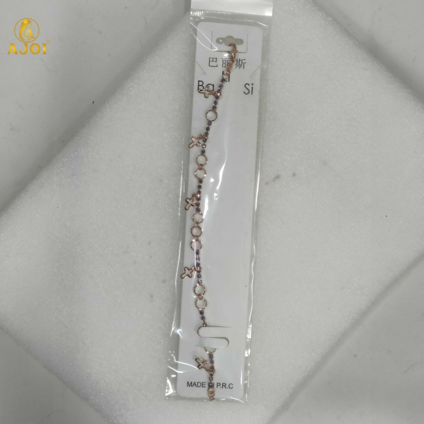 Rose gold plated bracelet adorned with fine crystals and minimalist charms