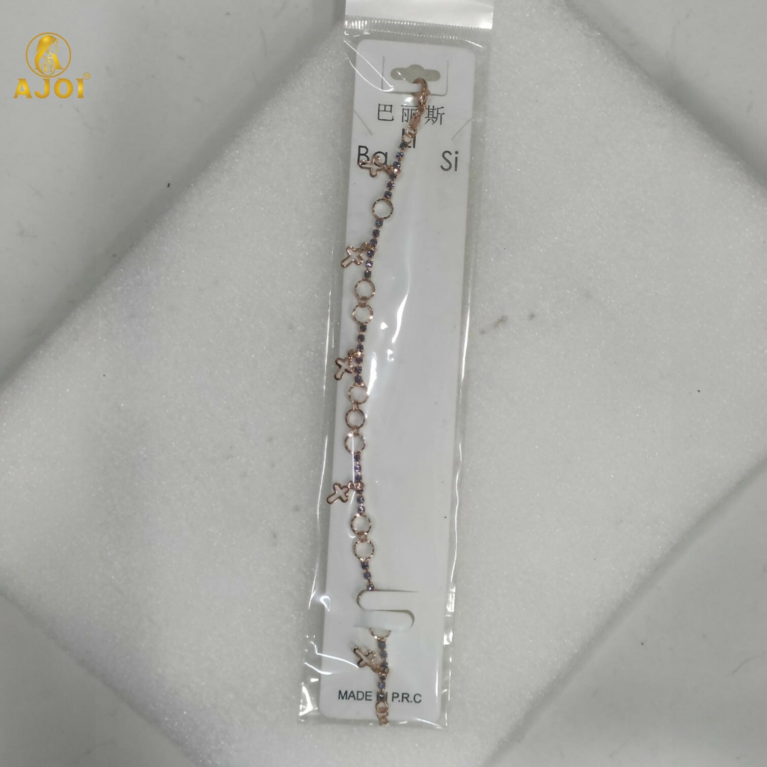Rose gold plated bracelet adorned with fine crystals and minimalist charms
