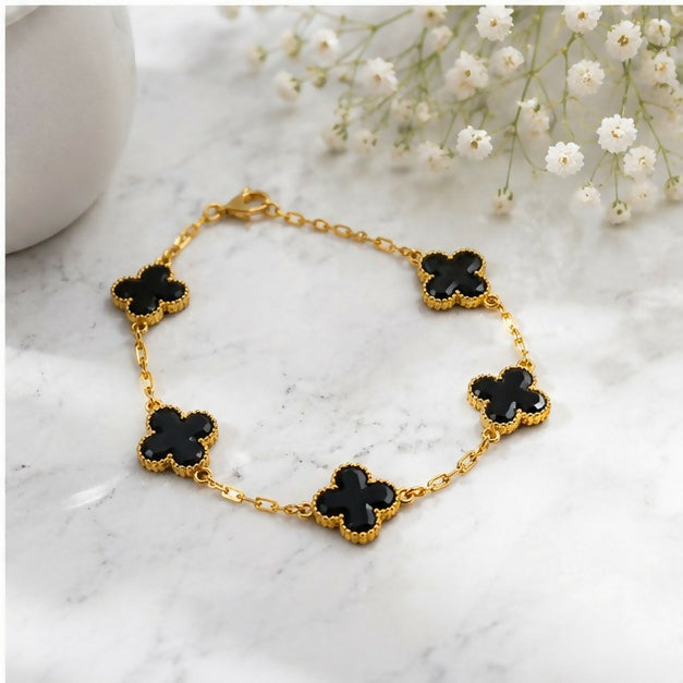 Four Leaf Clover Charm Bracelet with Delicate Chain Links and Textured Edge Detailing
