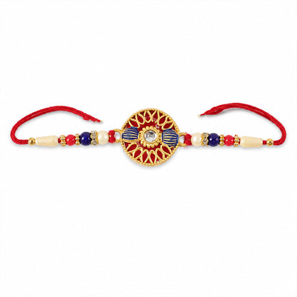 Raksha Bandhan Rakhi with golden threads and pearl accents.