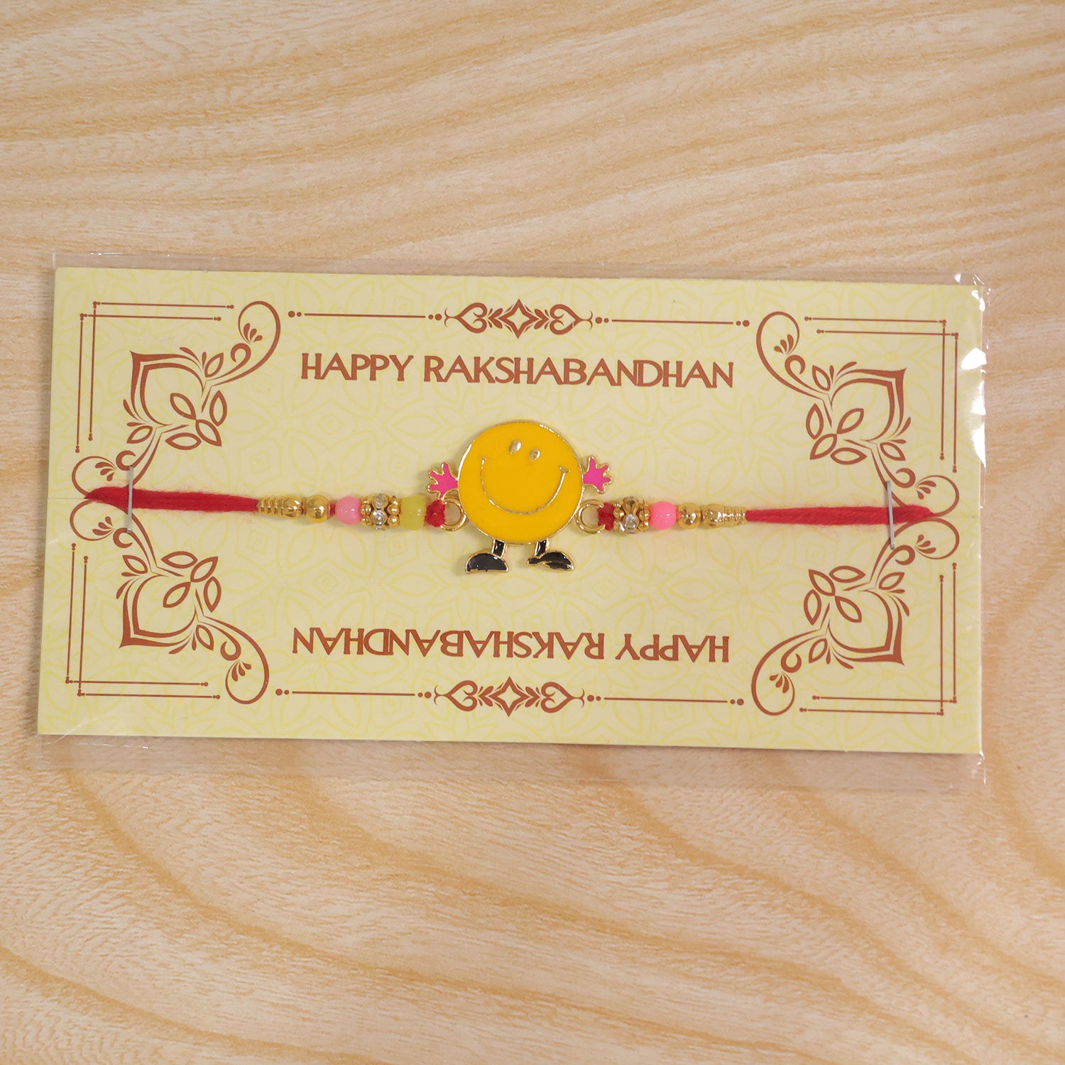 Smiley Kids Rakhi showcasing its overall design and vibrant colours.