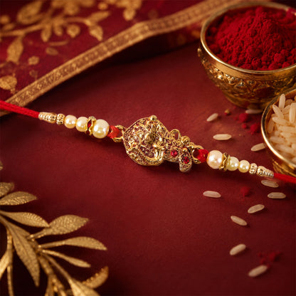 Golden Peacock Rakhi – Elegant Pearl Beads & Thread Chain Rakhi for brother