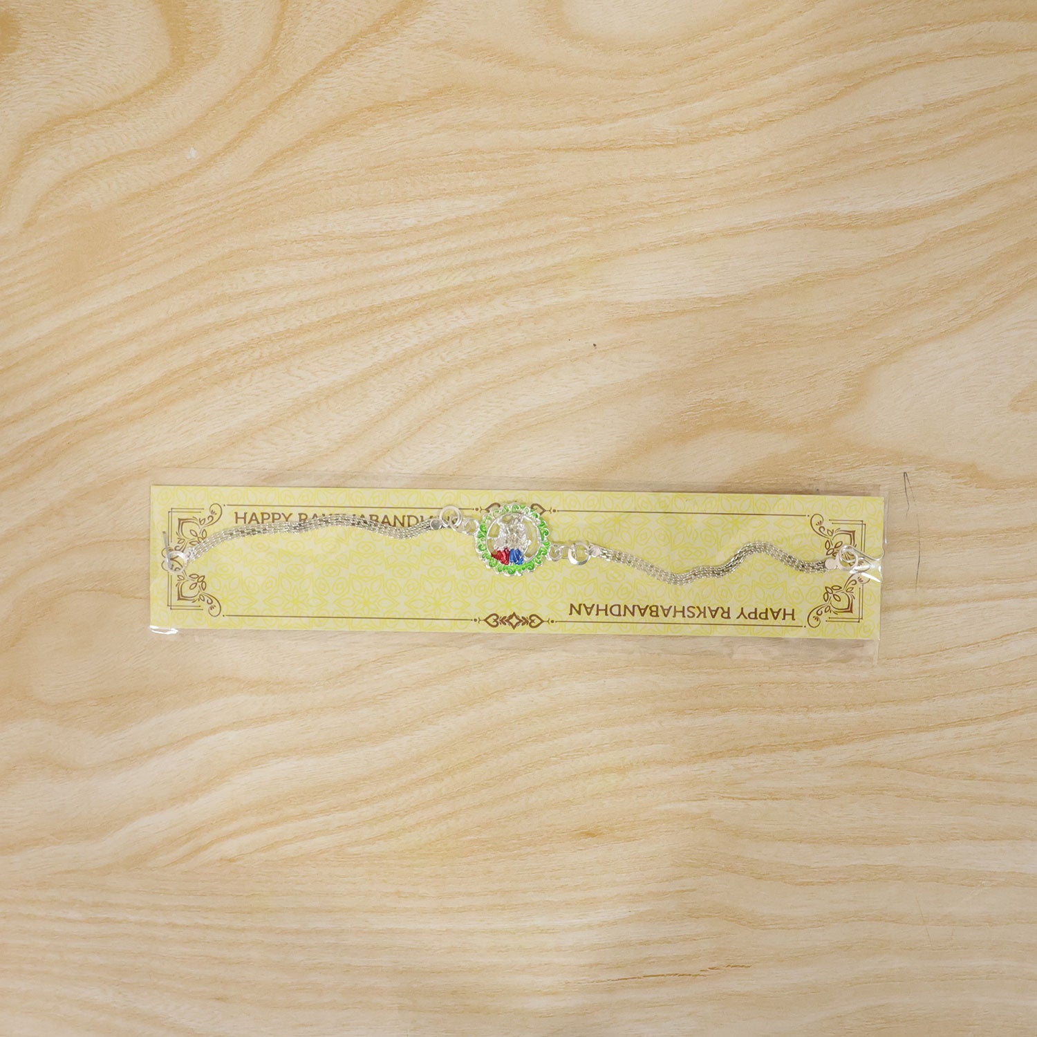 Radha Krishna Rakhi – Elegant Silver Chain Design