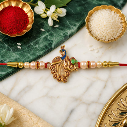 Peacock Design Rakhi – Elegant Pearl Beads & Golden Detailing