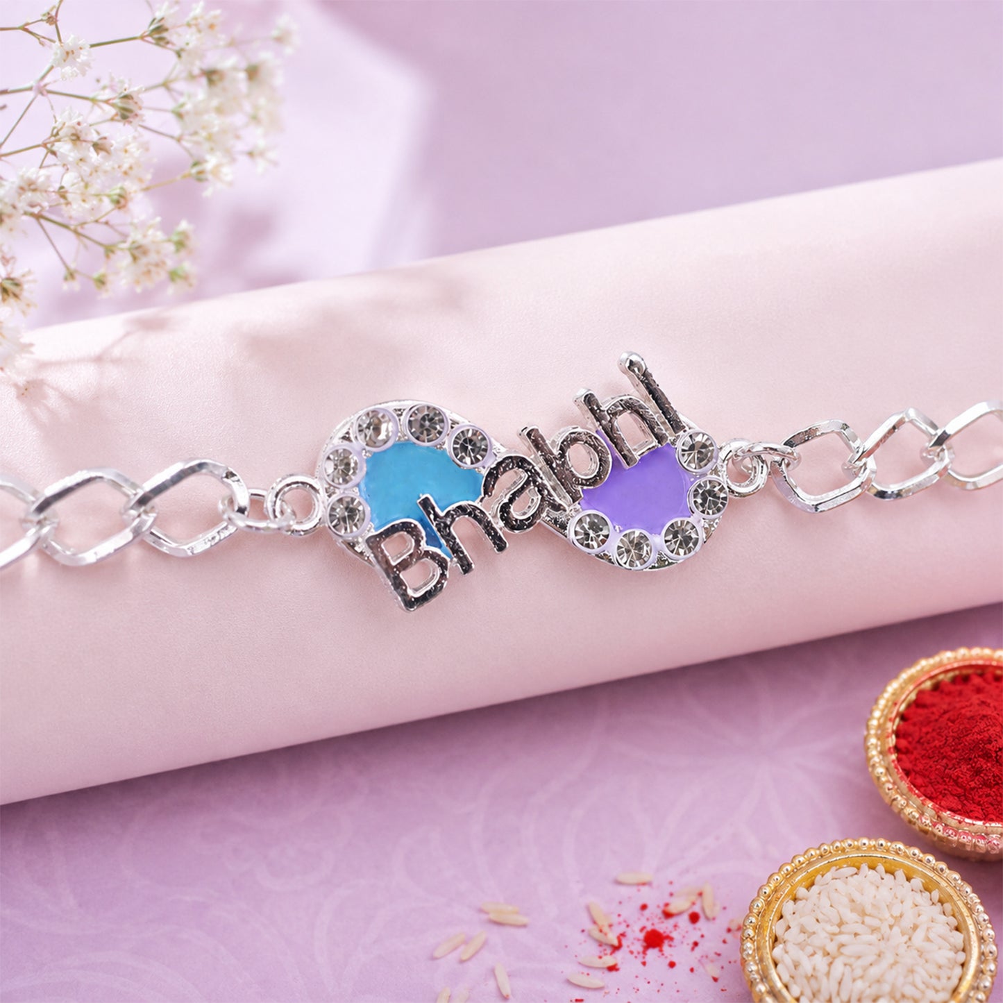 Stone studded Bhai Rakhi on a white background, showcasing chain style.