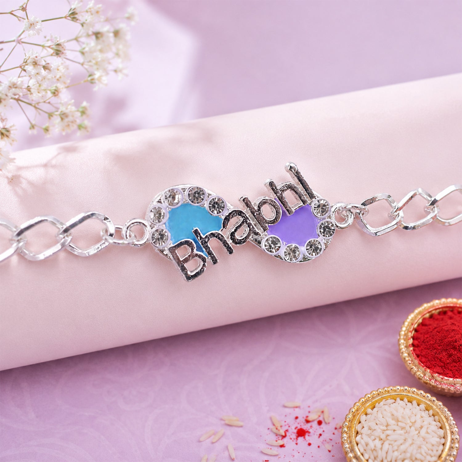 Stone studded Bhai Rakhi on a white background, showcasing chain style.