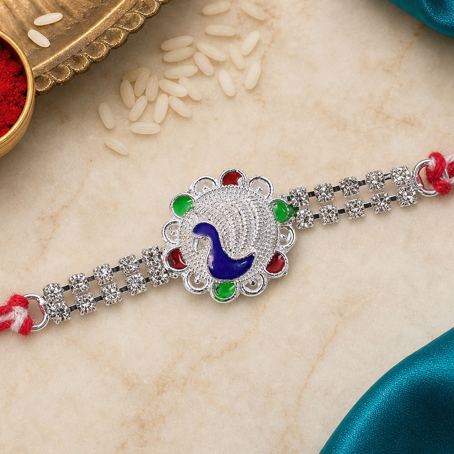 Classic Rakhi showcasing Paisley Swirl Charm, crystal sparkle and gift style for Gift