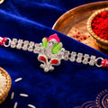 Silver-Toned Lord Ganesha Rakhi with Pink-Green Enamel, Double Crystal Chain & Red-White Thread