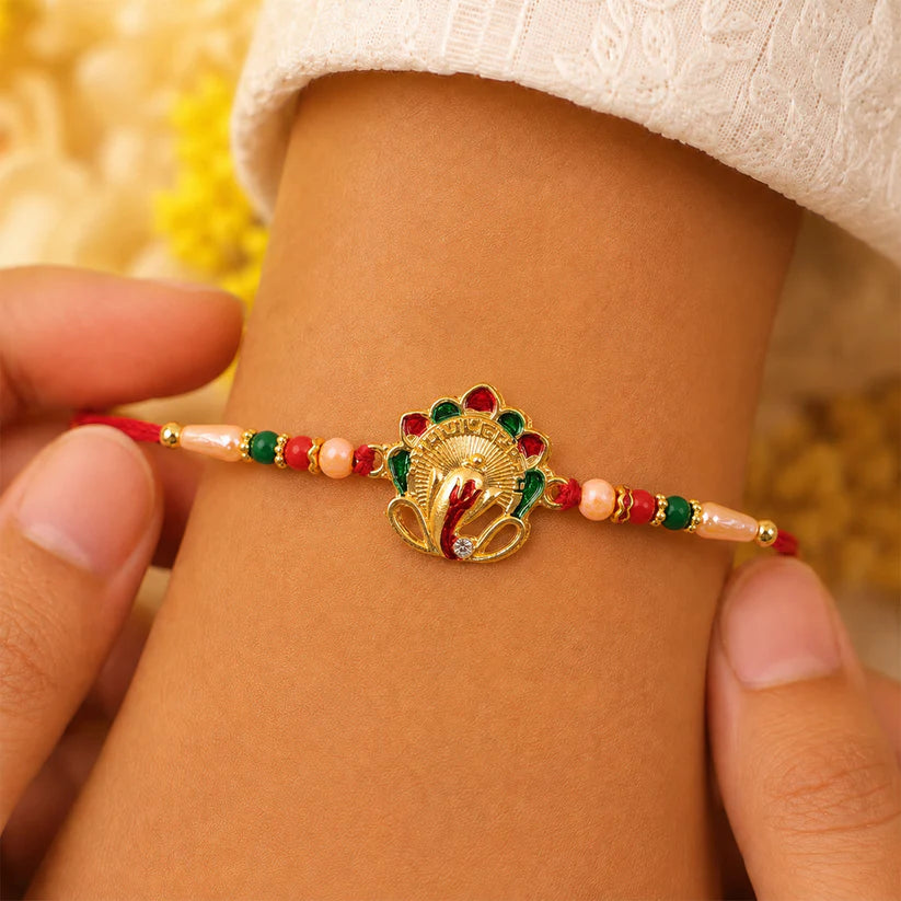 Side view of the Ganesha rakhi with its vibrant multicolor beaded thread.