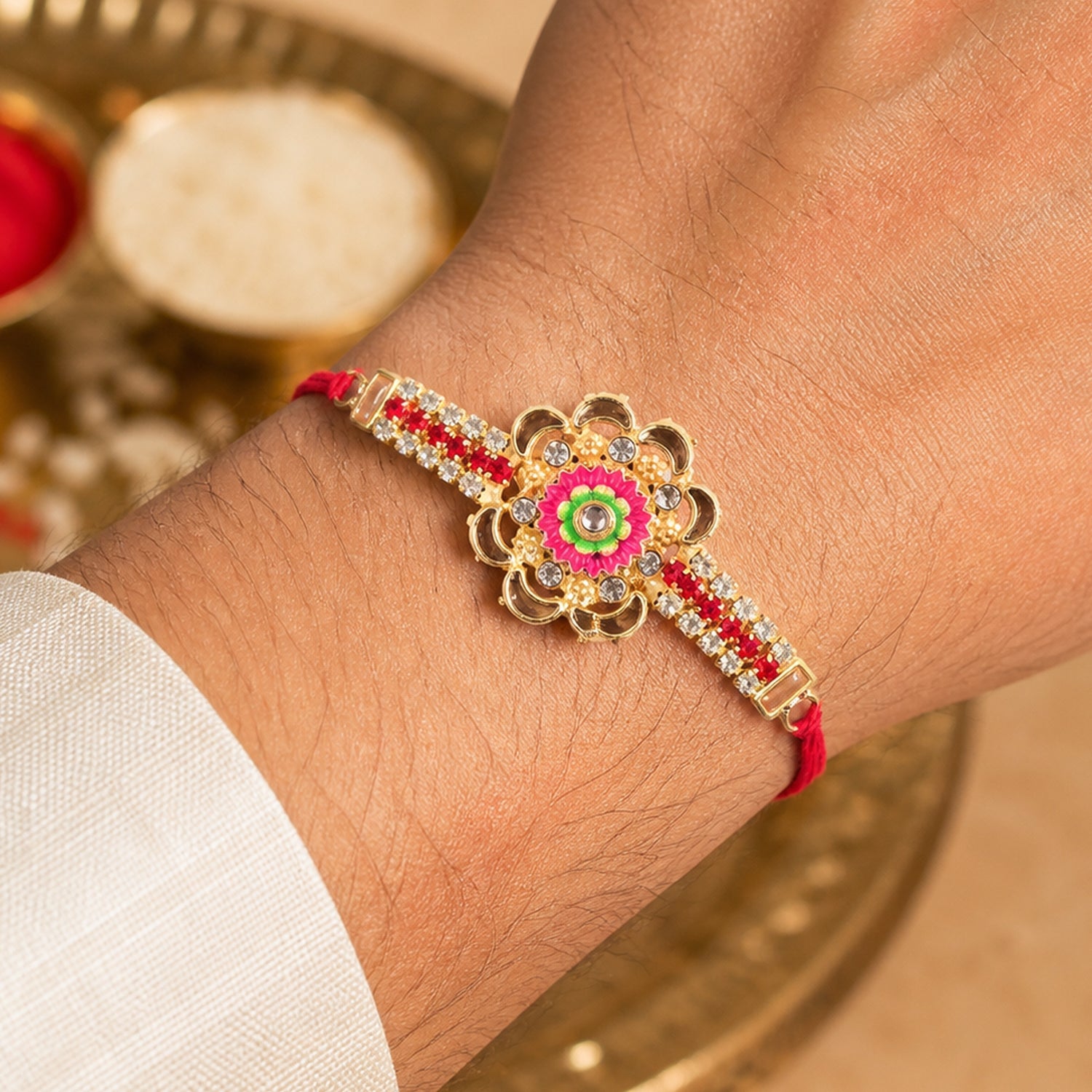 Diamond Rakhi – Stone Studded Floral Design with Colorful Enamel