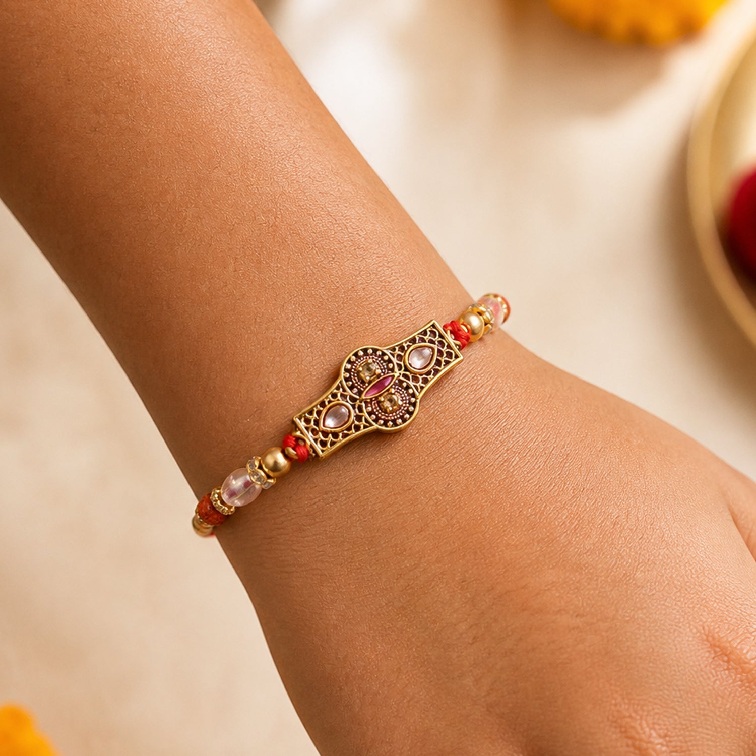 Rose Pink Kundan Stone Pendant Rakhi with Rudraksha and Coral Beads