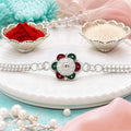 Buy Flower Rakhi for Brothers Silver Finish Mirror Stone