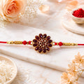 Red Floral Stone Rakhi with Bead Accents for Raksha Bandhan