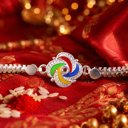 Brother wearing a stylish Silver Rakhi with feather accents on his wrist.