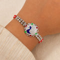 Classic Rakhi showcasing Paisley Swirl Charm, crystal sparkle and gift style for Gift