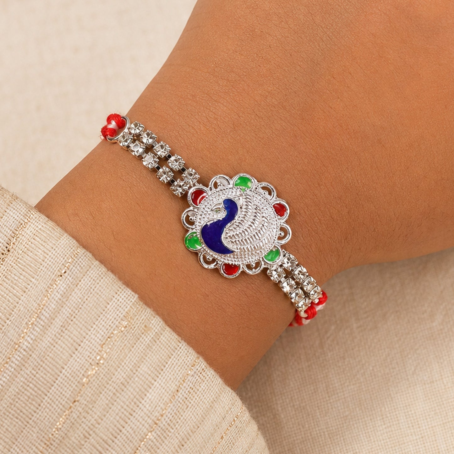 Classic Rakhi showcasing Paisley Swirl Charm, crystal sparkle and gift style for Gift