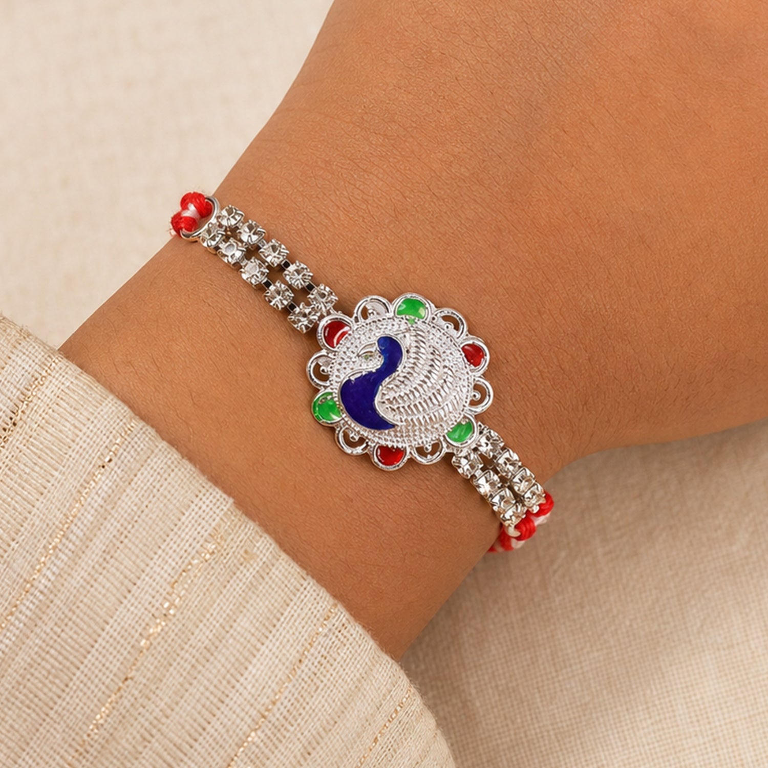 Classic Rakhi showcasing Paisley Swirl Charm, crystal sparkle and gift style for Gift