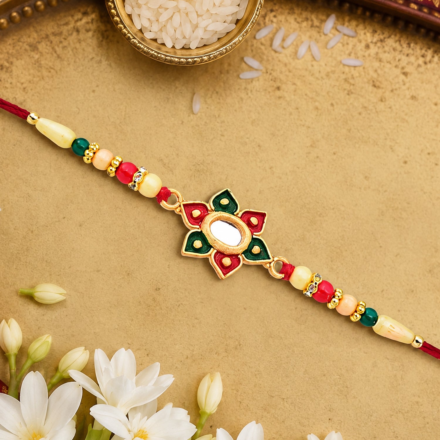 Floral Rakhi with Multicolor Stone Work – Elegant Raksha Bandhan Gift