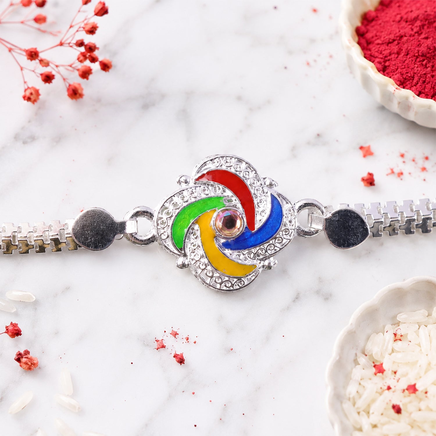 Silver Rakhi placed elegantly on a gift box, ready for Raksha Bandhan.